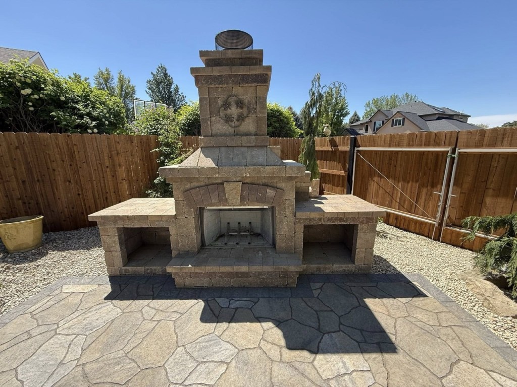 Complete Landscape Redesign with Pavers, Fireplace & Water Feature
