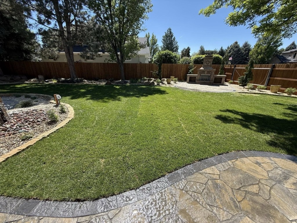 Complete Landscape Redesign with Pavers, Fireplace & Water Feature