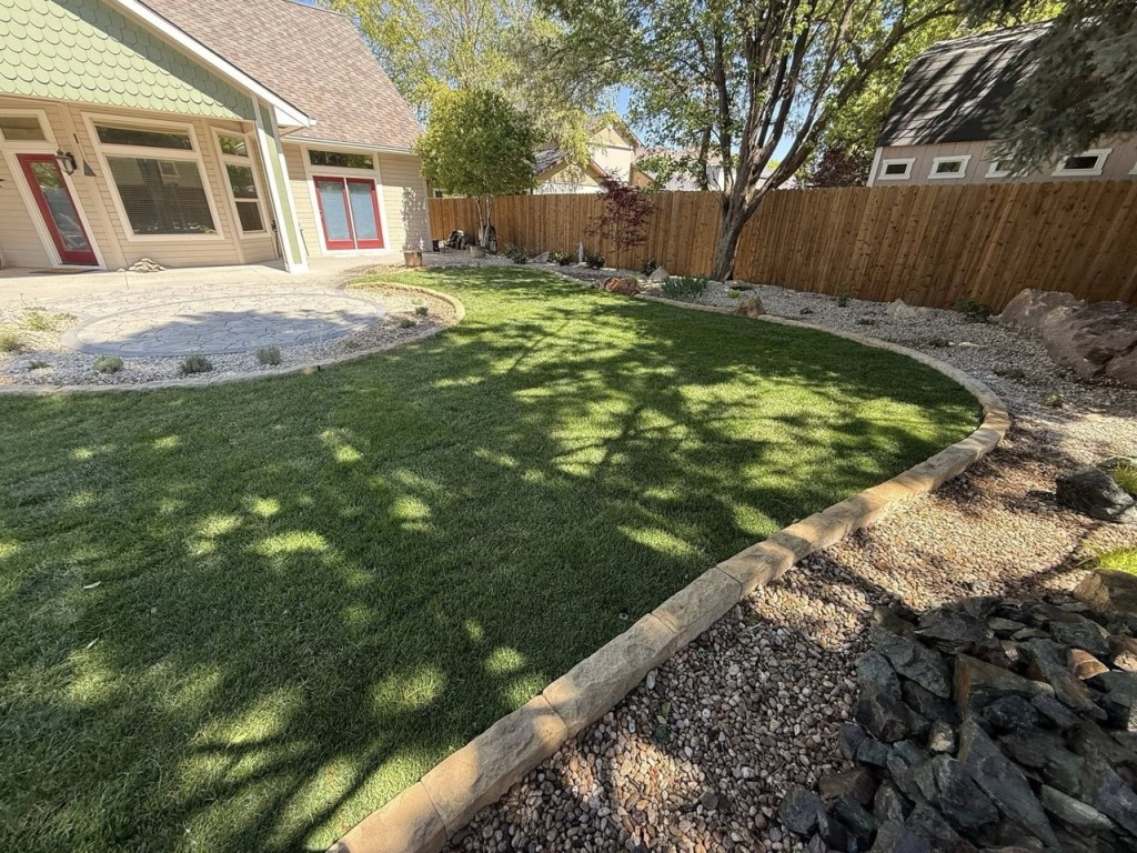 Complete Landscape Redesign with Pavers, Fireplace & Water Feature