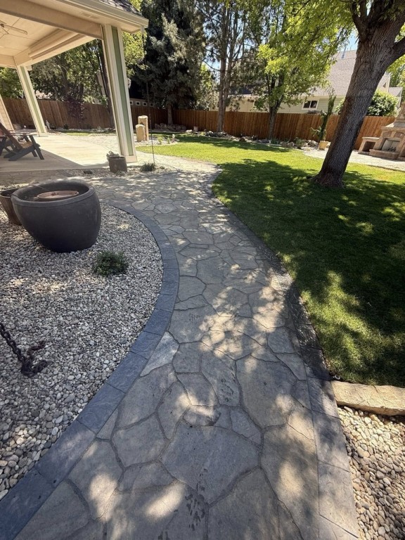 Complete Landscape Redesign with Pavers, Fireplace & Water Feature